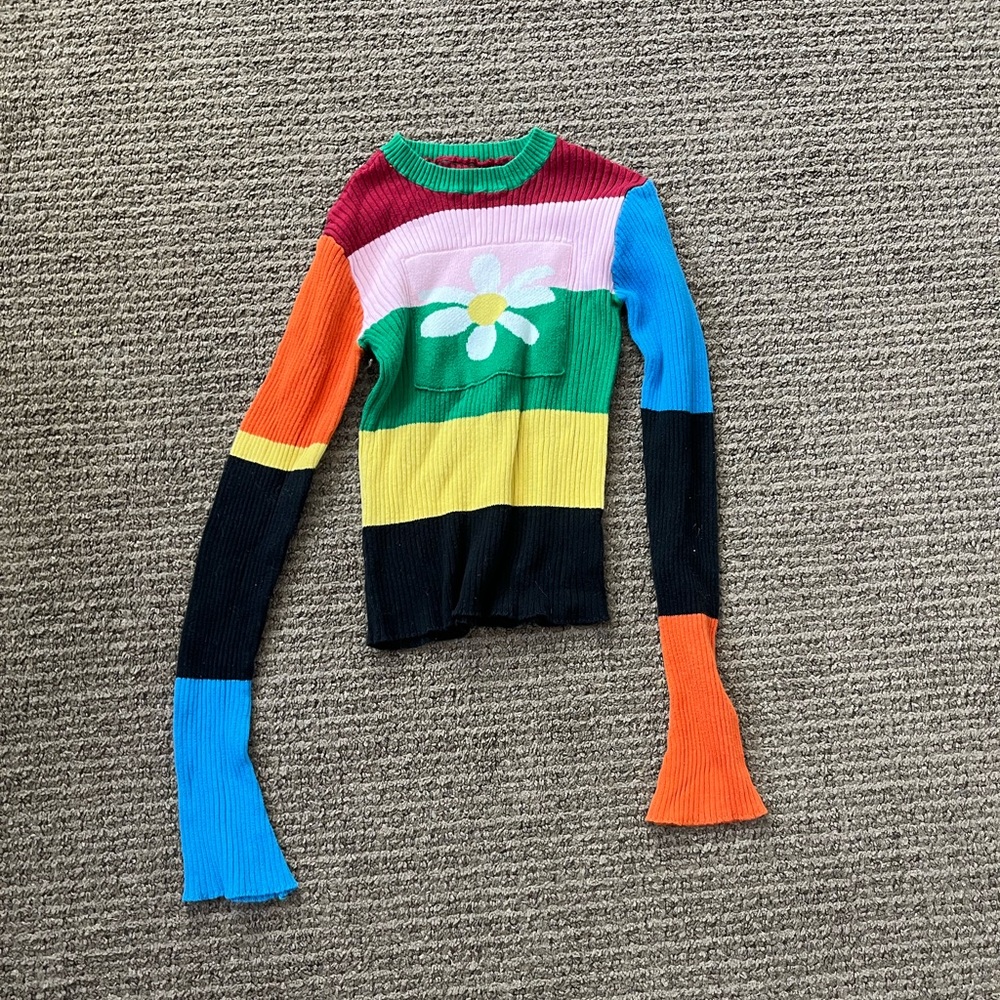Patched cotton sweater. Fits a girls small or XS.